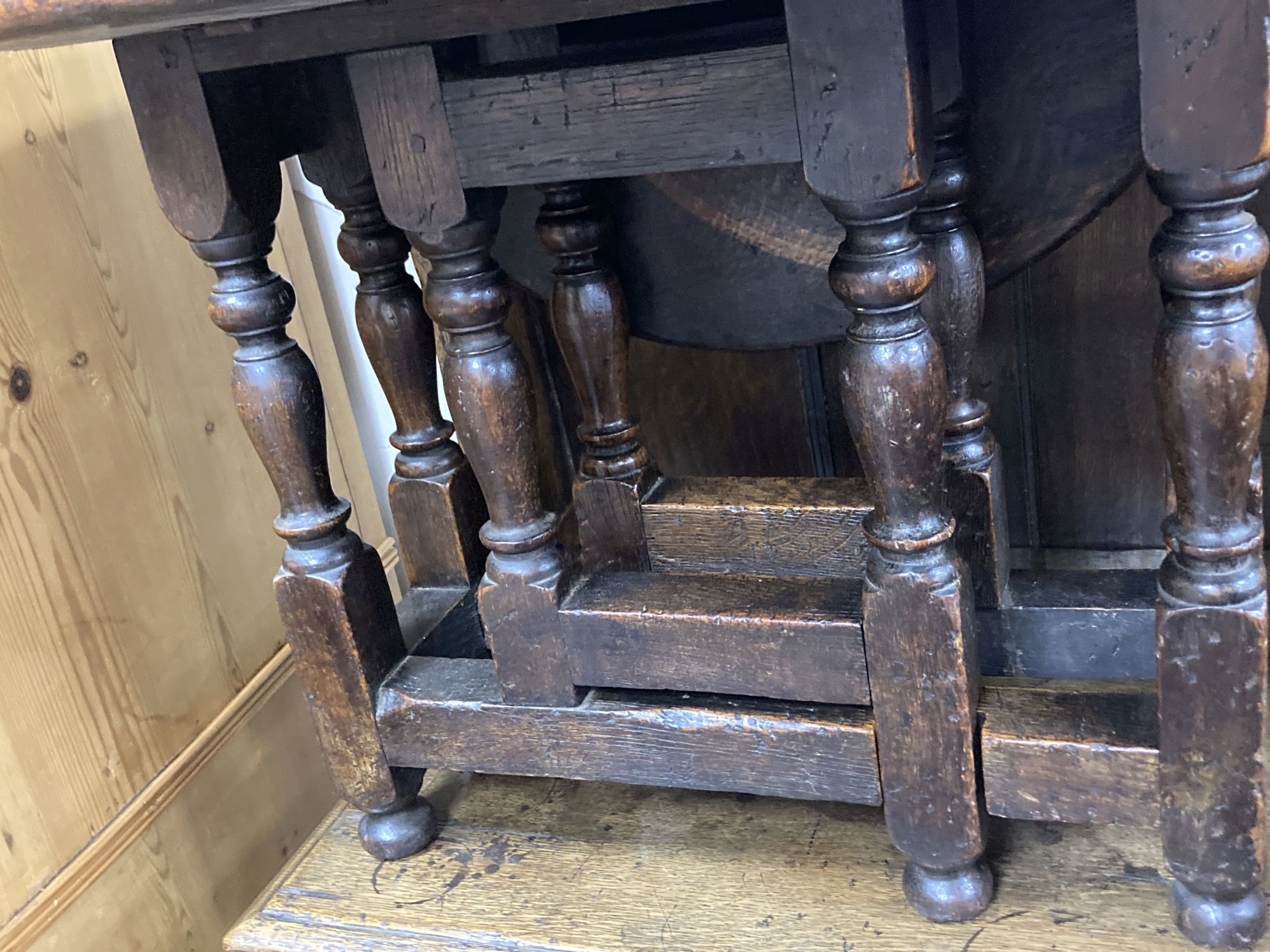 A 19th century miniature oak drop leaf gateleg table with turned supports, height 48cm, top 62 x 48cm